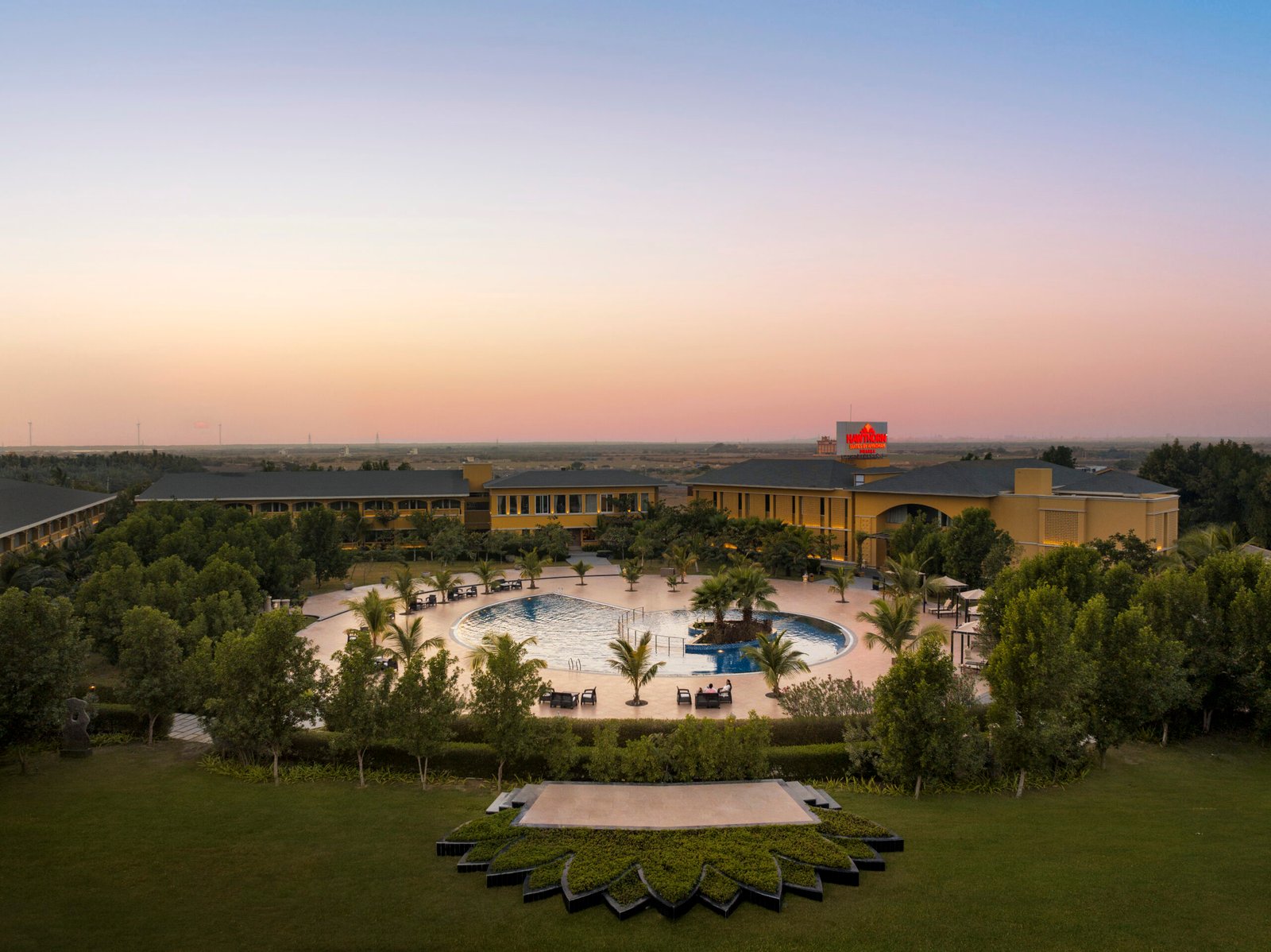 Aerial view of Hawthorn Suites by Wyndham Dwarka at dusk